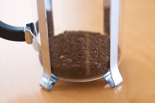Ground beans in the press